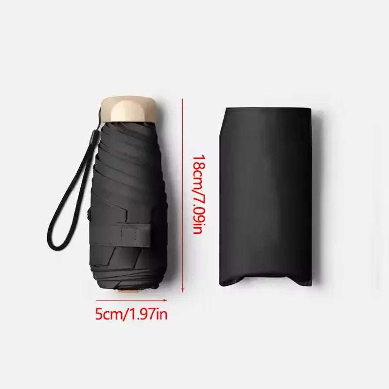 Mini paraguas de bolsillo para lluvia, sombrilla plegable de vinilo