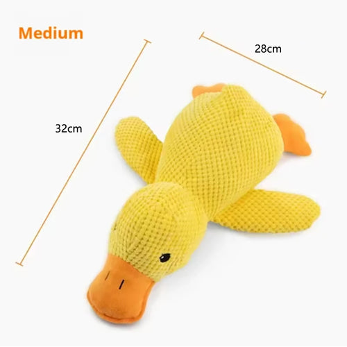 Dog sleeping with a dog hug duck toys to relieve boredom of little